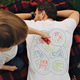 Image for article titled Genius T-Shirt Playmat Includes a Built-In Massage for Mom or Dad